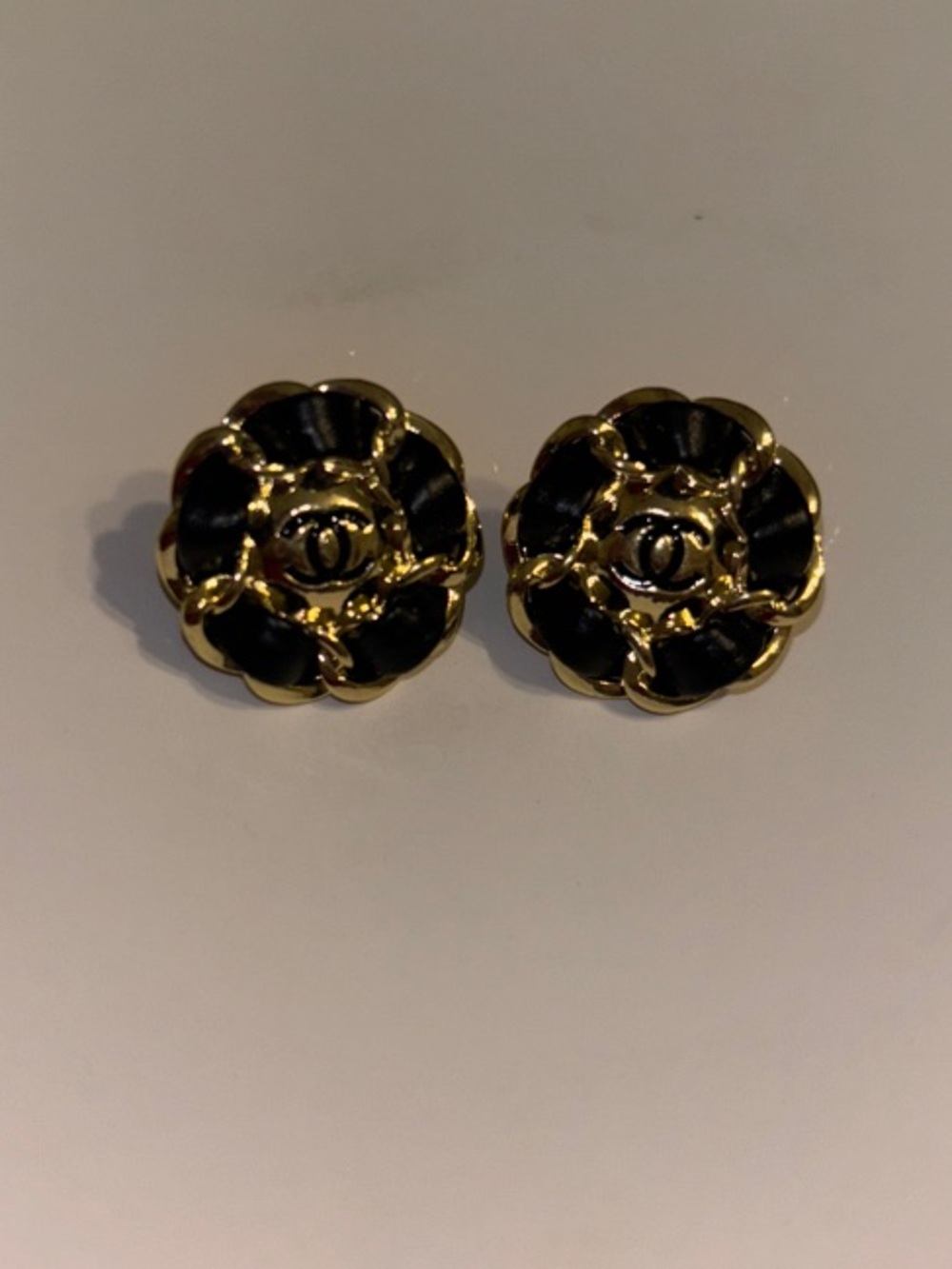 CHANEL Black and Gold Camellia Clip-On Earrings